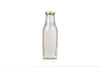 Coconut oil in glass bottle for representation purpose only